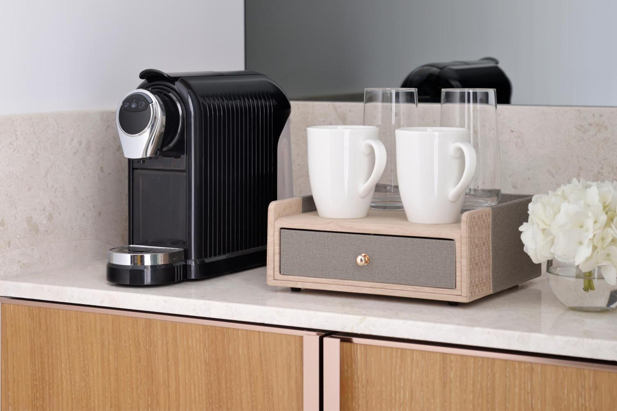Moevenpick Hotel & Apartments Ghala مسقط المظهر الخارجي الصورة A Nespresso coffee machine